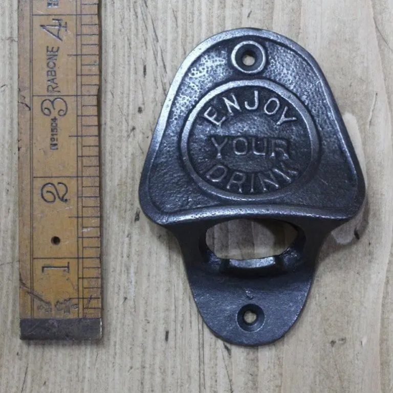 Enjoy your drink on a cast antique iron wall mountable bottle opener