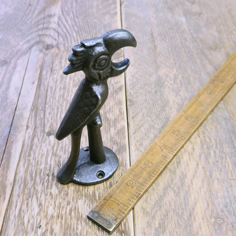 Hand held cast iron parrot bottle opener