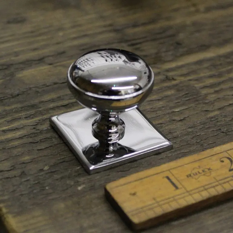 classic chrome polished knob on a square back plate